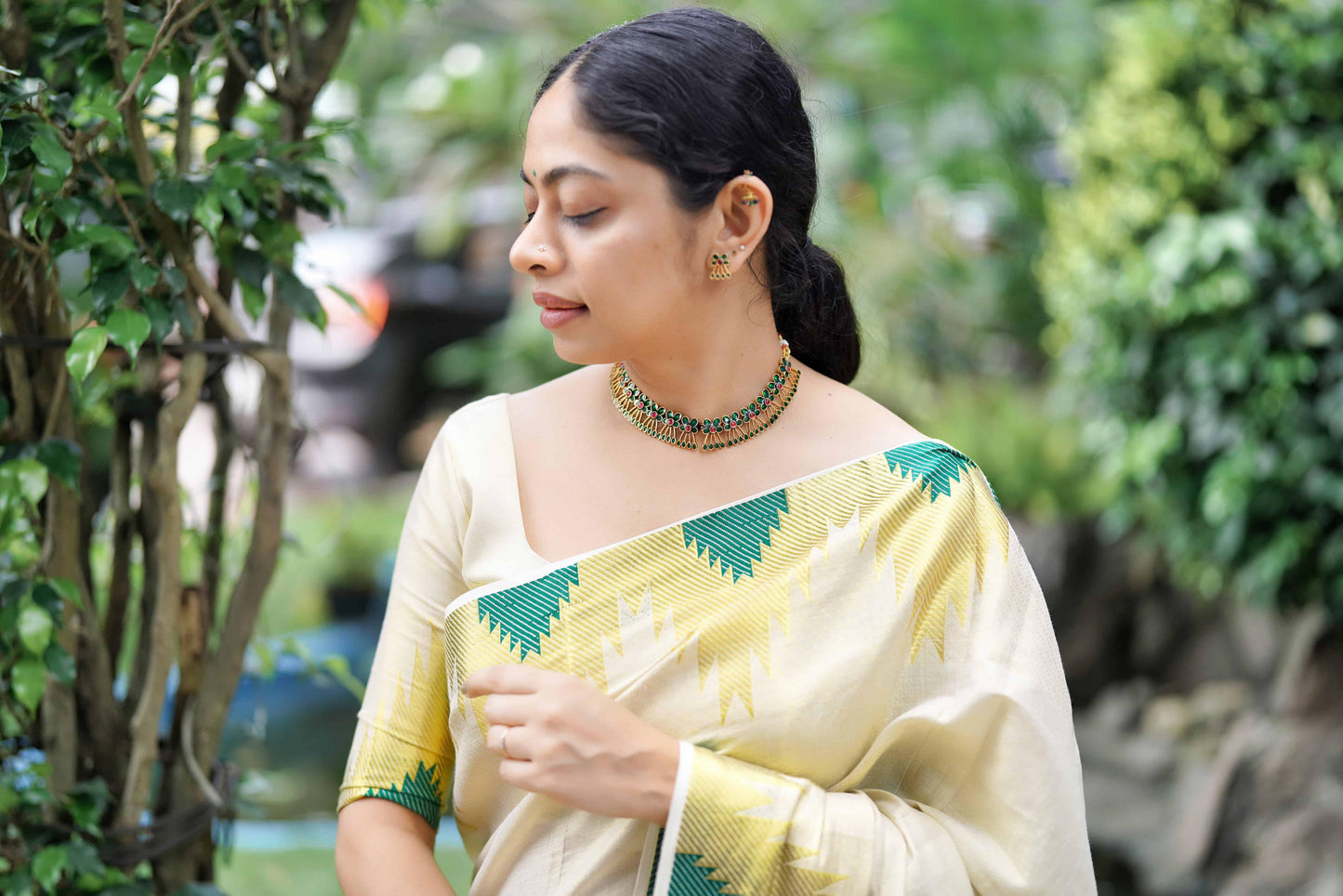 Golden Tissue Saree with Bottle Green Temple Motifs