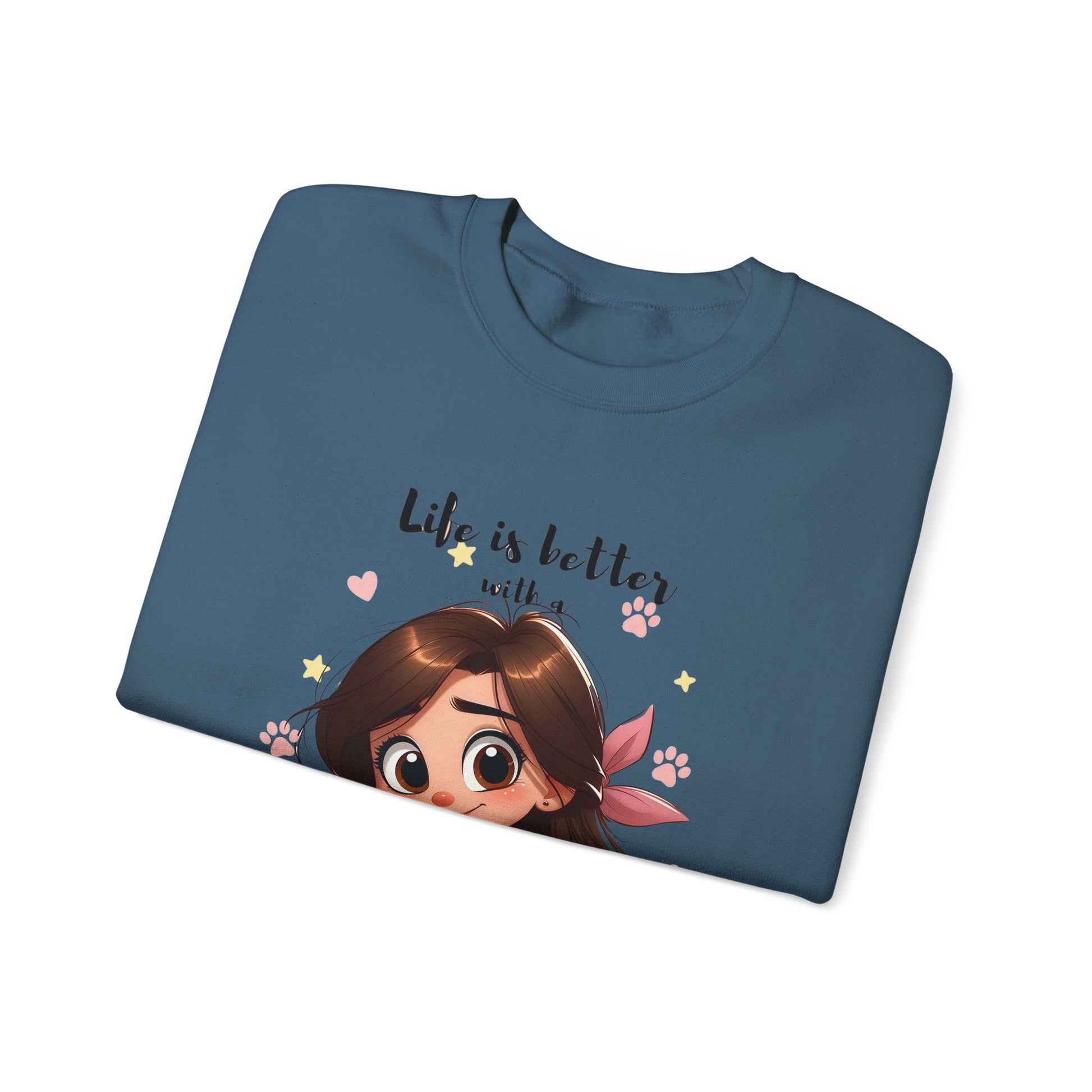 Folded blue t-shirt with cartoon character and 'Life is better with a' text on a white background