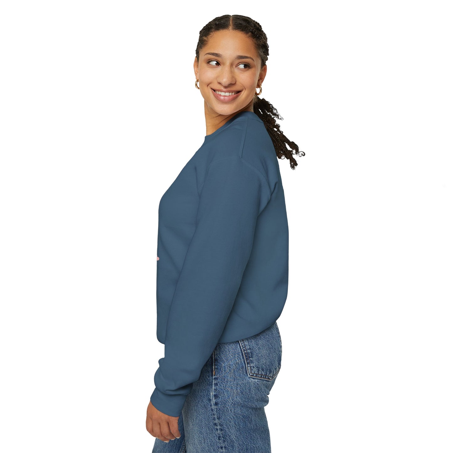 Woman wearing a blue sweatshirt and jeans on a white background