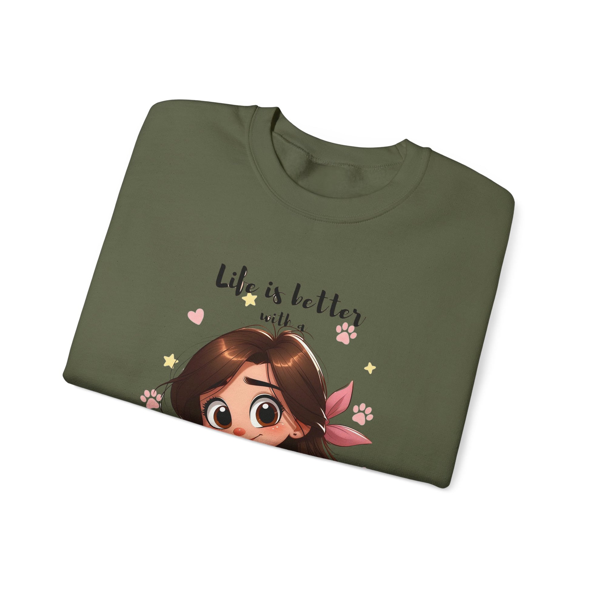 Folded green t-shirt with cartoon character and text 'Life is better with a' on a white background