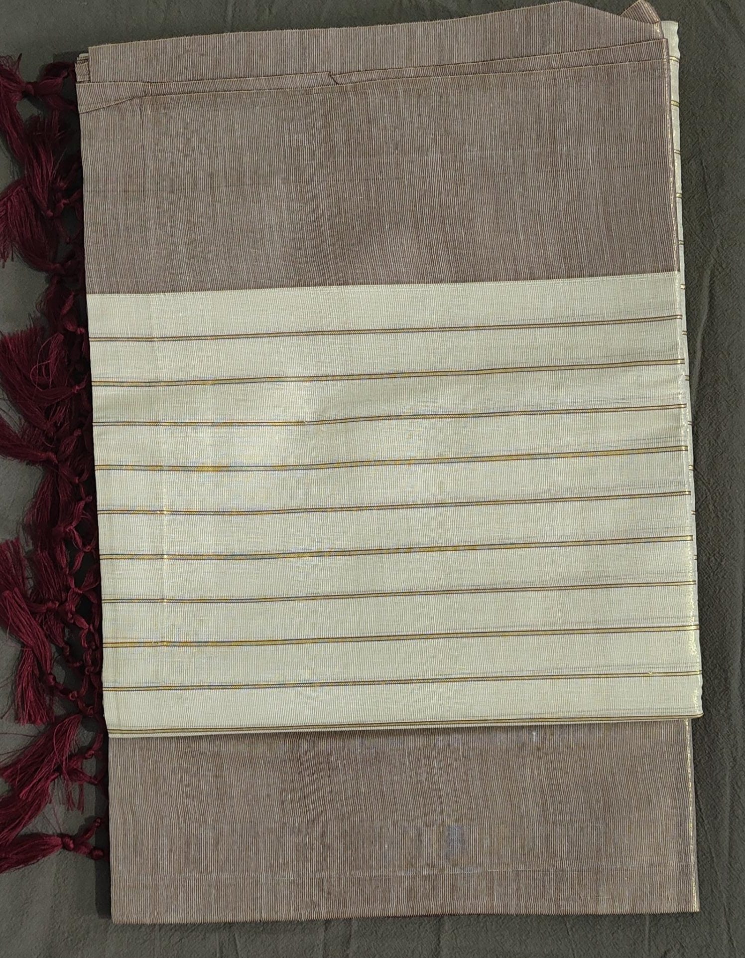 Fabric with brown and beige stripes on a plain background