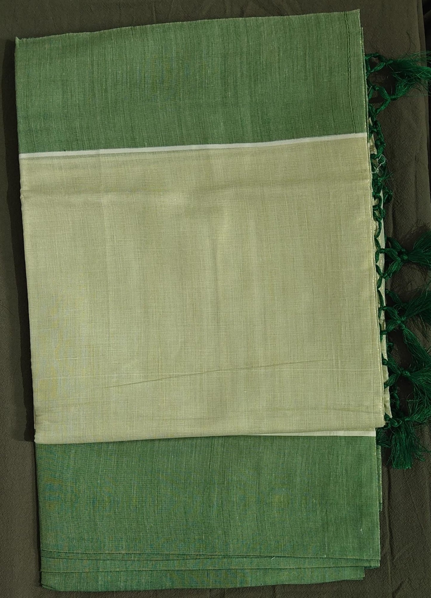 Green and beige saree with a plain background