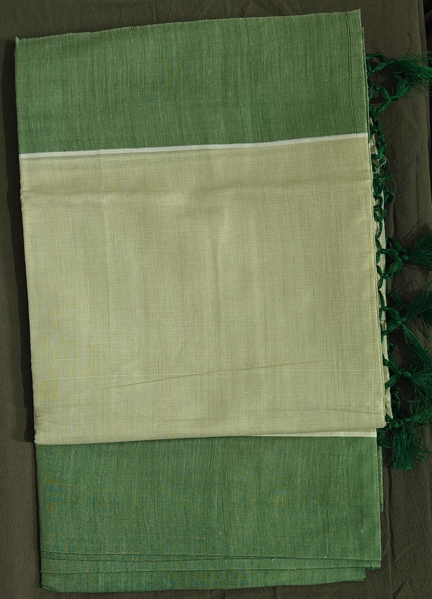 Green and beige saree with a plain background