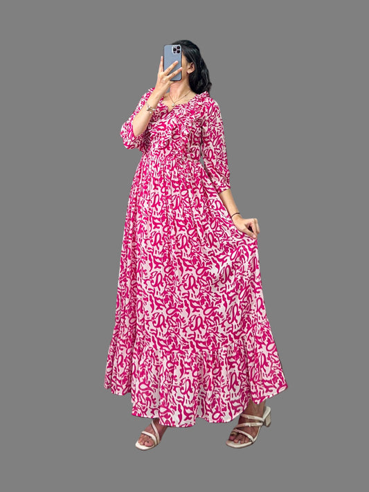 Woman wearing a pink floral dress taking a mirror selfie