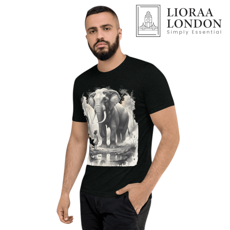 A man wearing a black Lioraa London Ltd cotton t-shirt featuring a watercolour graphic of a girl and an elephant.