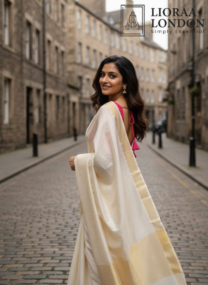 Lioraa London Ltd gajri cotton silk blouse with sweetheart neckline worn with a cream saree on a city street.