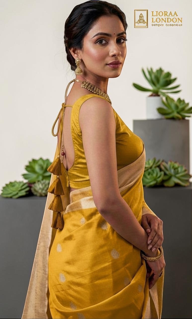 Lioraa London Ltd dark golden cotton silk saree blouse with deep U-back, tassels, and sweetheart neckline on a model.