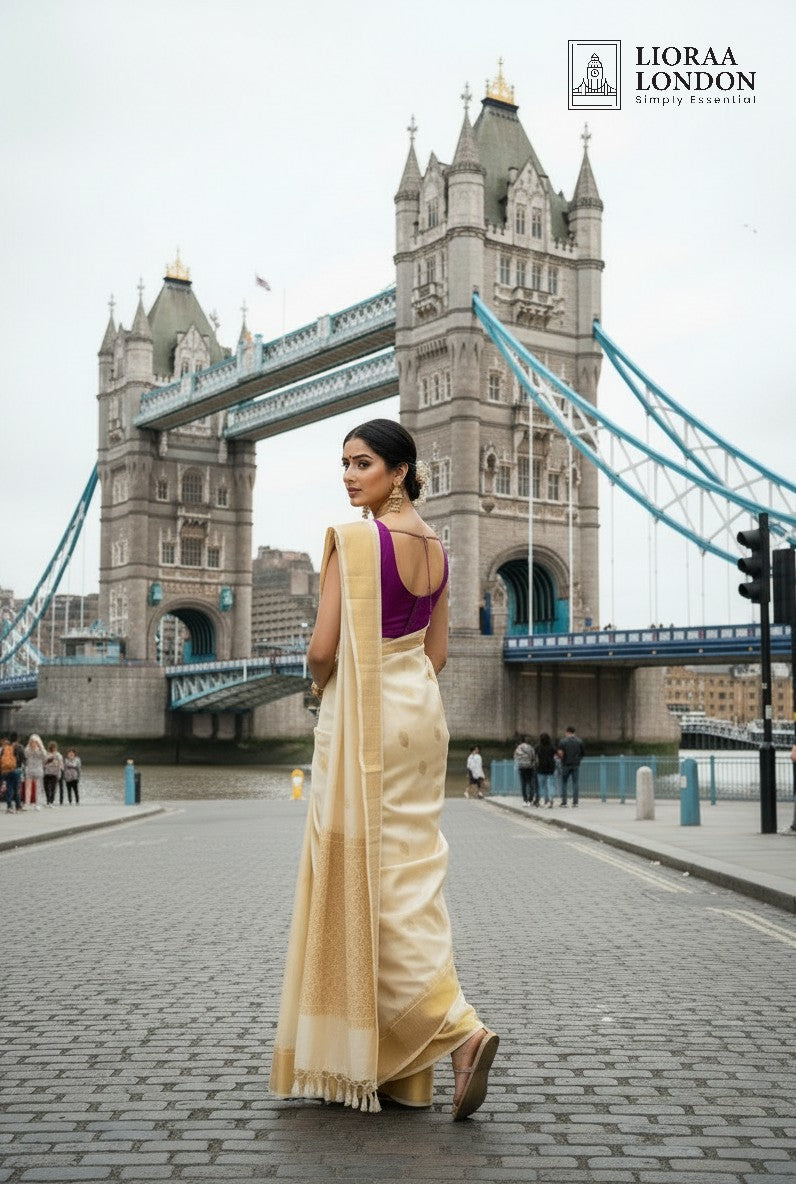 Lioraa London Ltd purple rani silk blouse with sweetheart neckline and deep U-back worn with a cream saree in London.