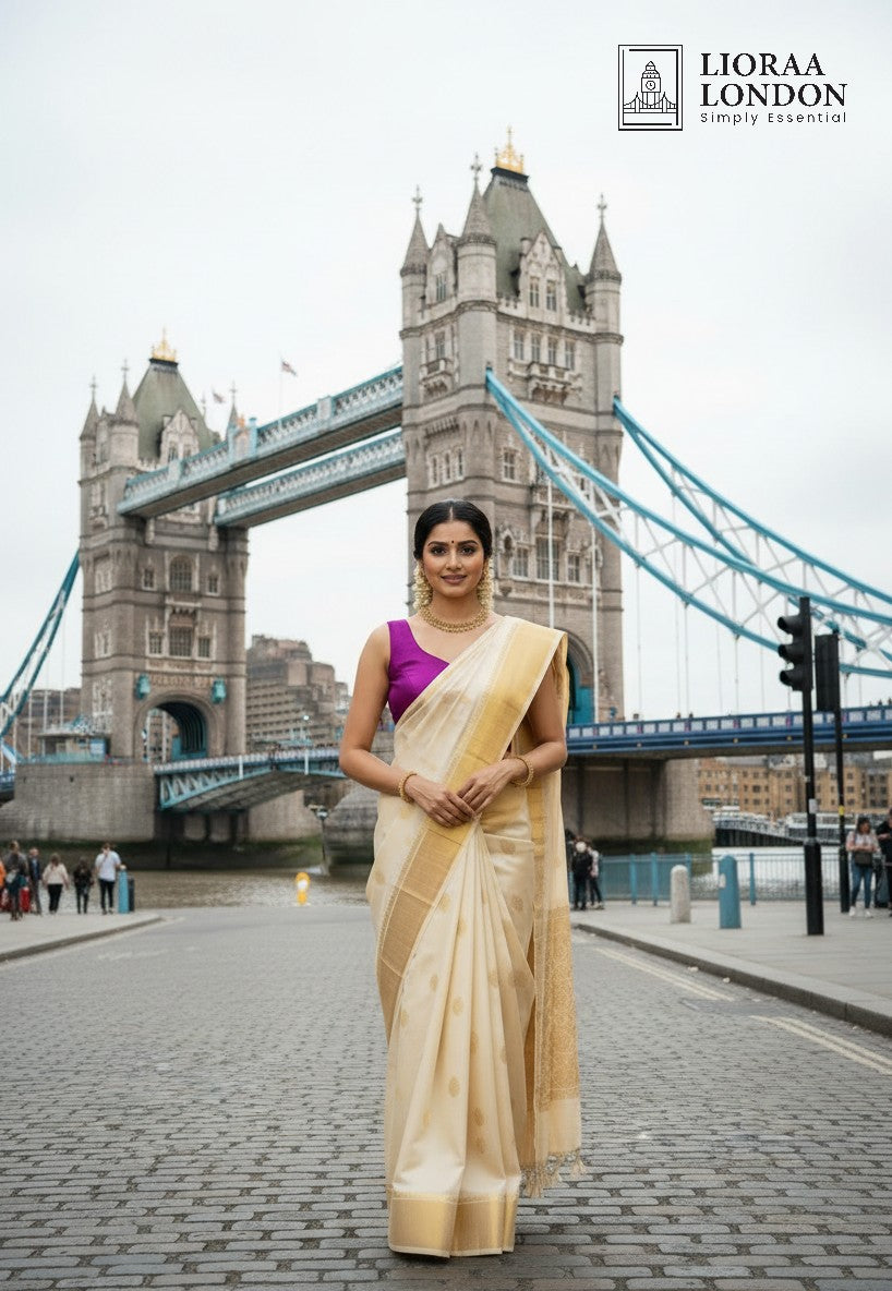 Lioraa London Ltd purple rani silk blouse worn with a cream saree in front of Tower Bridge in London