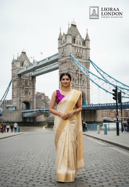 Lioraa London Ltd purple rani silk blouse worn with a cream saree in front of Tower Bridge in London