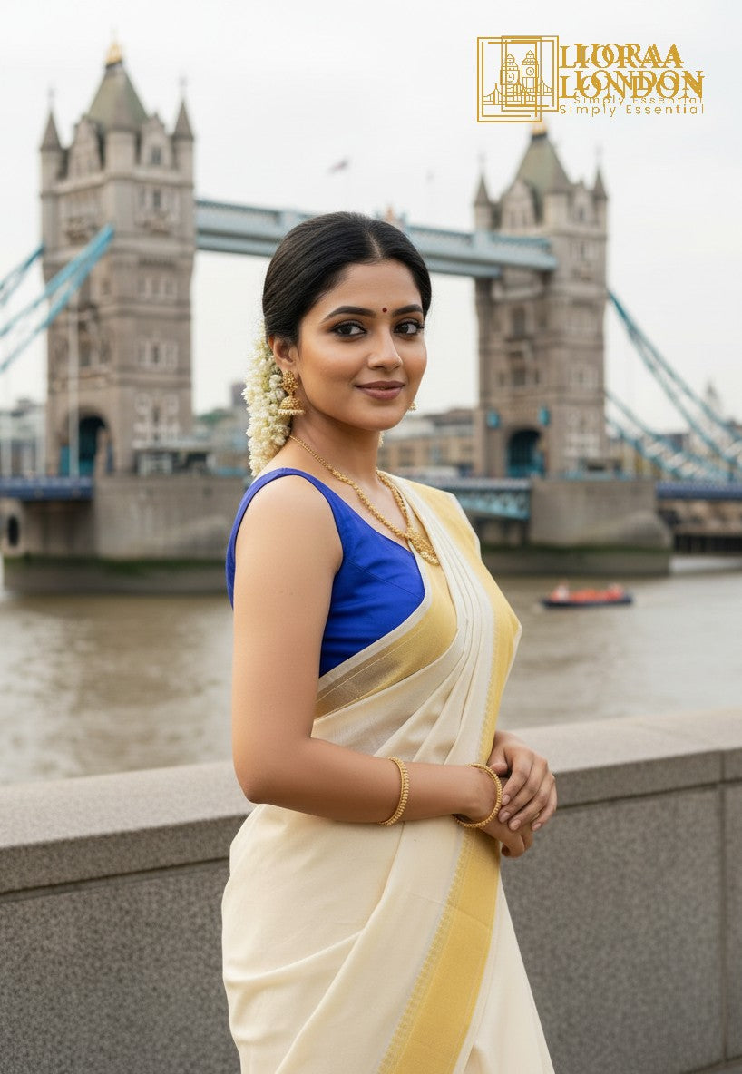 Lioraa London Ltd royal blue cotton silk blouse with sweetheart neckline worn by a woman at Tower Bridge in London