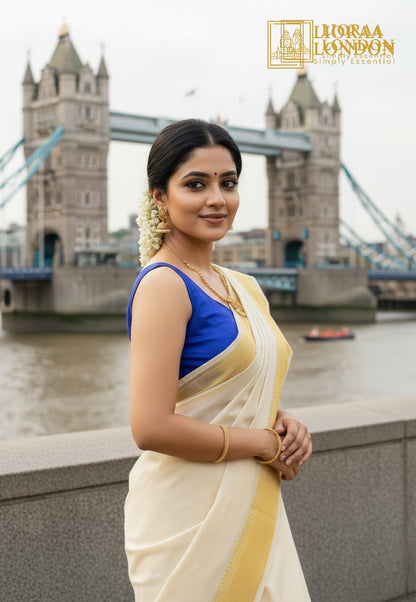 Lioraa London Ltd royal blue cotton silk blouse with sweetheart neckline worn by a woman at Tower Bridge in London